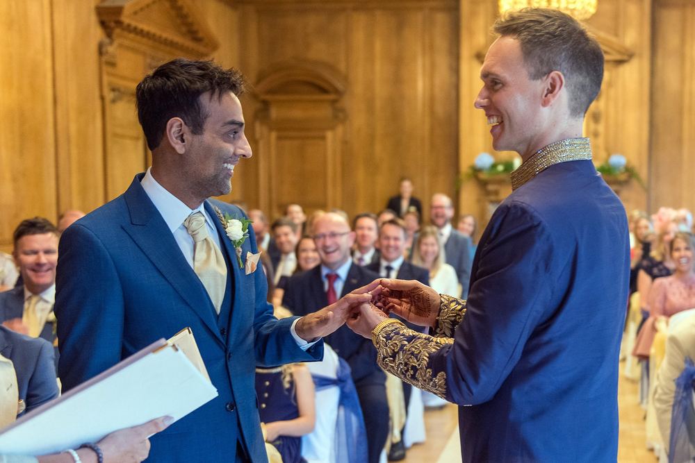 Chat & Ben exchange rings at their wedding ceremony at The Grand Hotel, York.