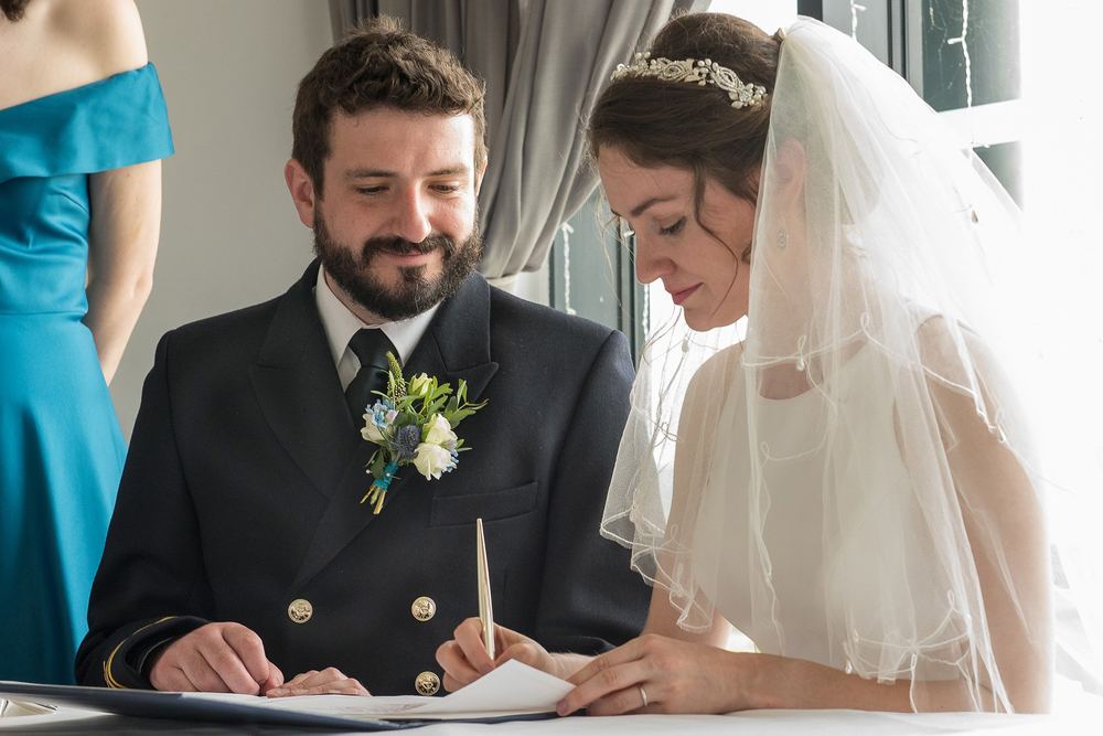 Gina & Matt sign the register at the KP Club, Pocklington, York.