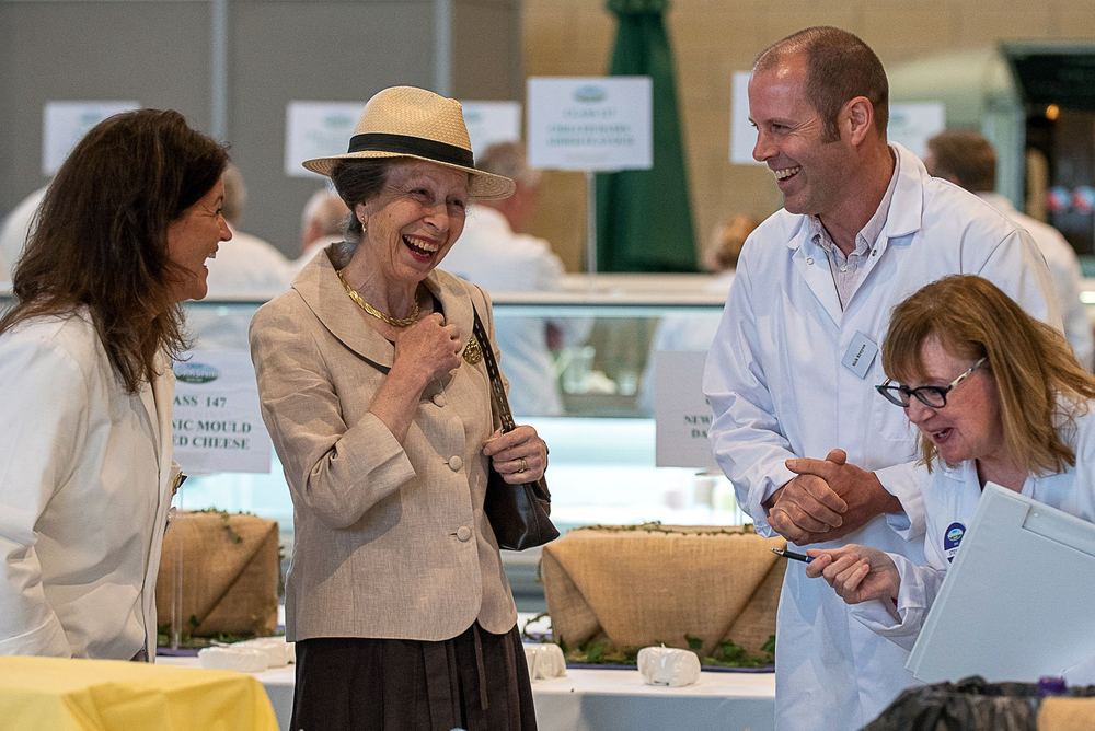 Princess Anne laughing with cheese judges at the Great Yorkshire Show.