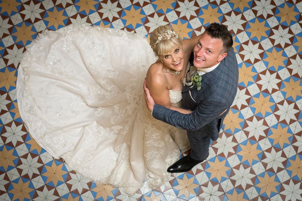 An overhead view of a bride and groom on the tiled floor at Rudby Hall, Yarm.