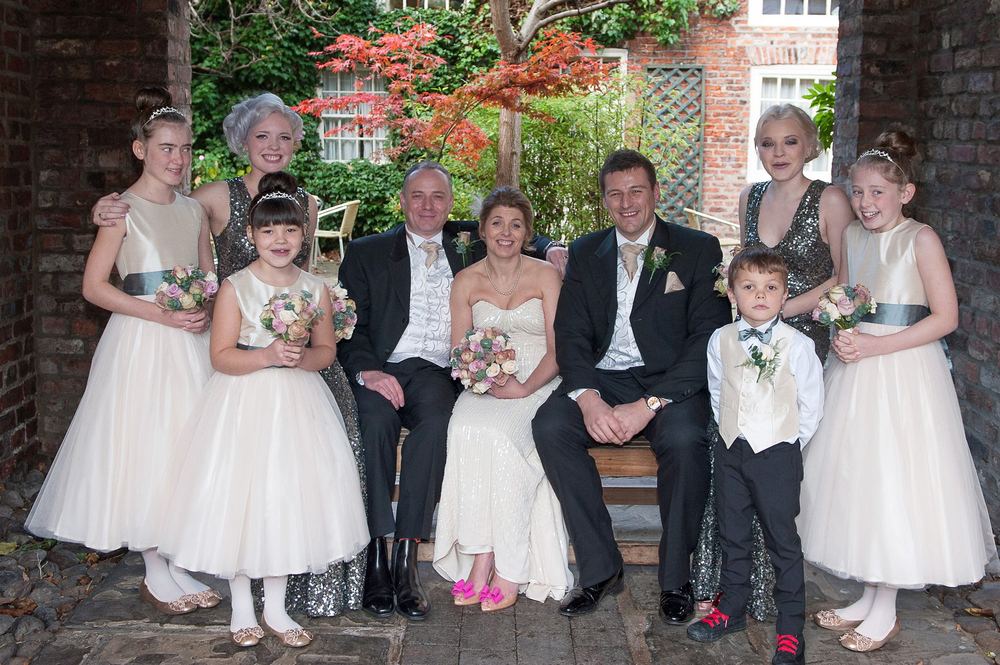 The bride, groom, best man, bridesmaids and flower girls at York Pavilion, Fulford.