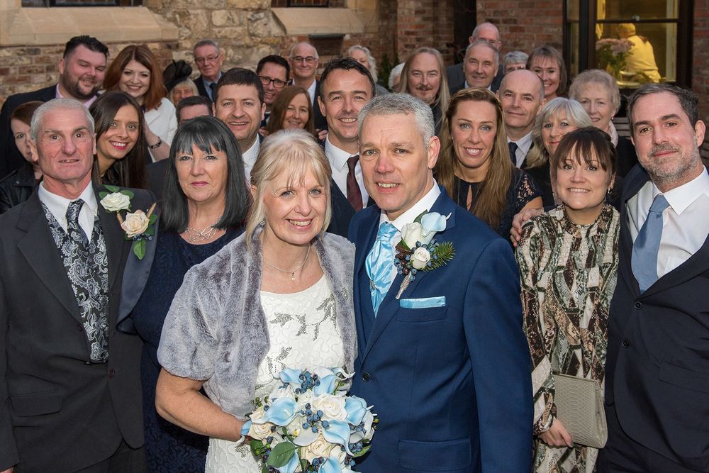 Wendy & Barry with all their wedding guests at Bedern Hall, York.